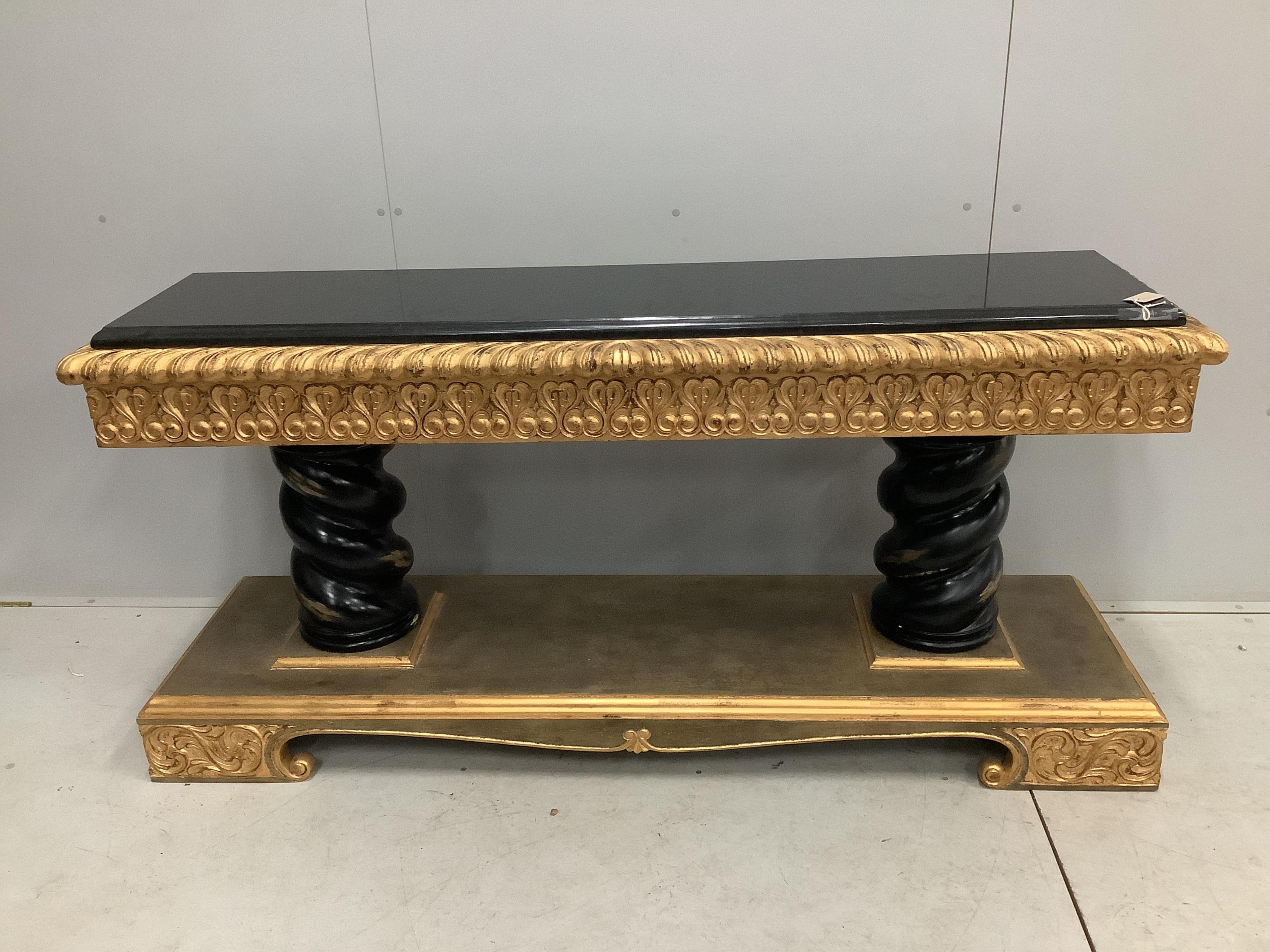 A Harrison Gil parcel gilt console table with marble inset top, width 180cm, depth 51cm, height 85cm and matching ornate wall mirror, width 138cm, height 165cm. Condition - fair to good, some minor chipping